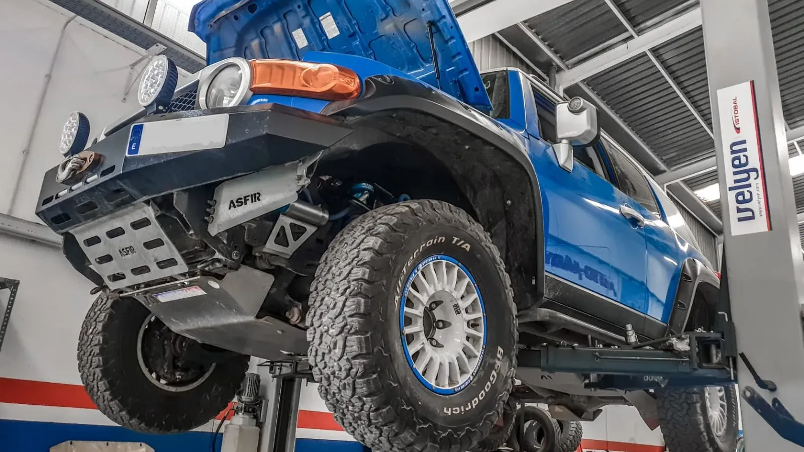 Toyota FJ Cruiser up on the workshop's two-post lift