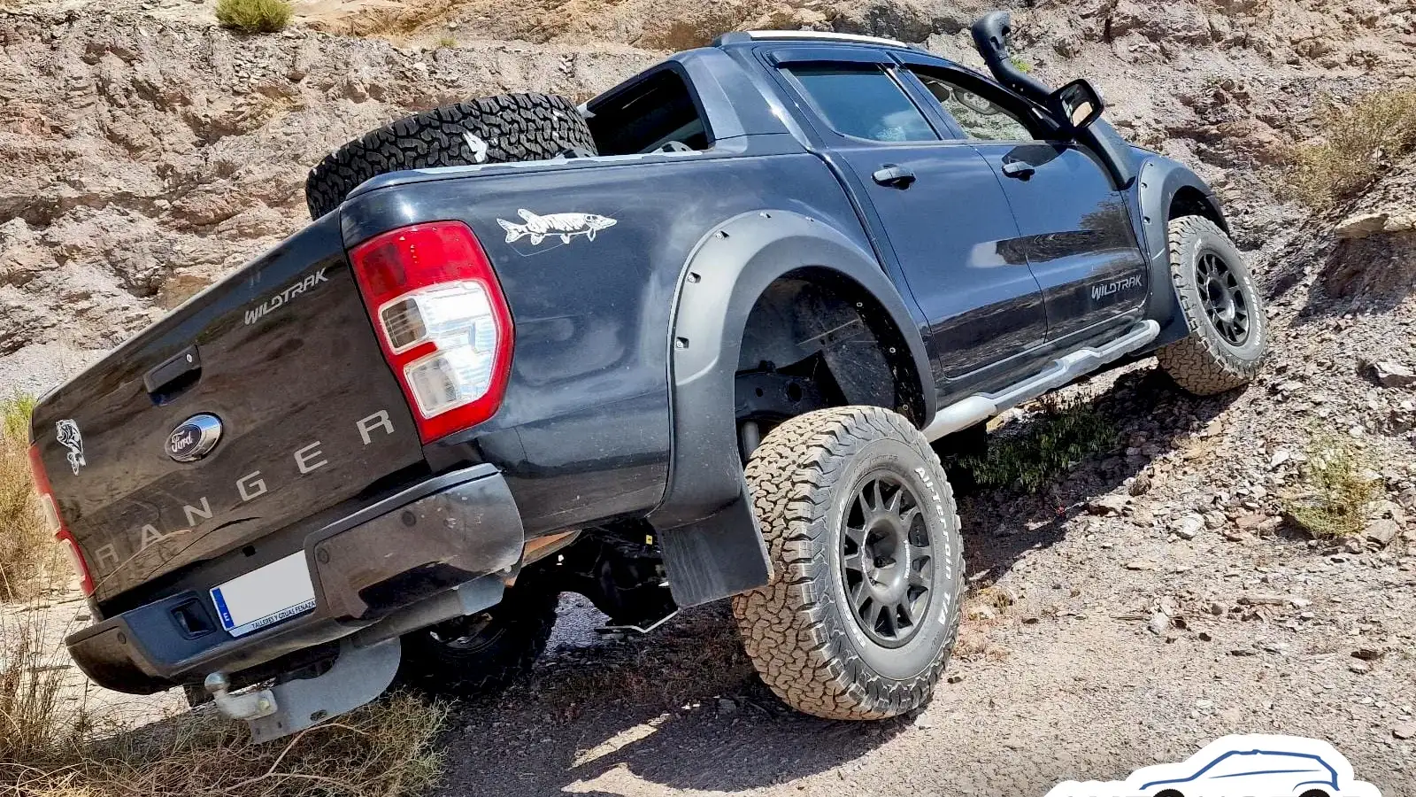 Ford Ranger on rock with the suspension working at full travel